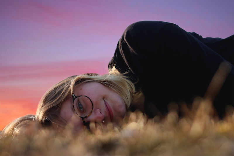 girl laying in grass